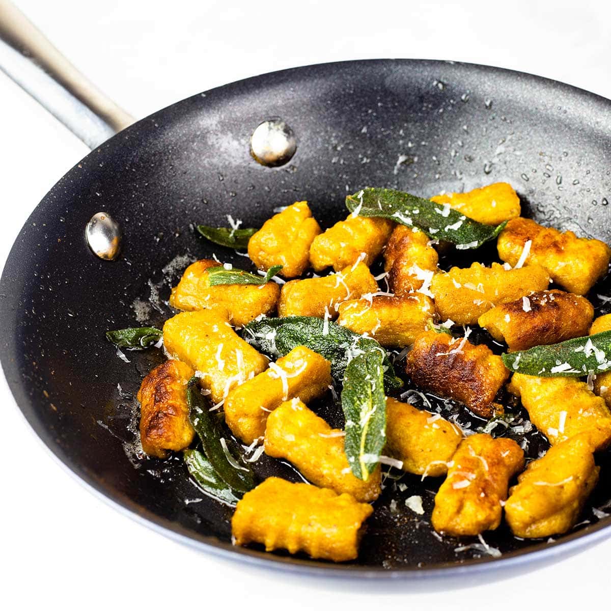 butternut squash gnocchi in a pan with brown butter and fried sage.