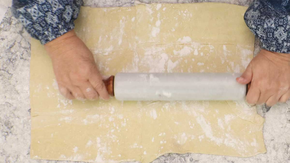 Rolling out puff pastry.