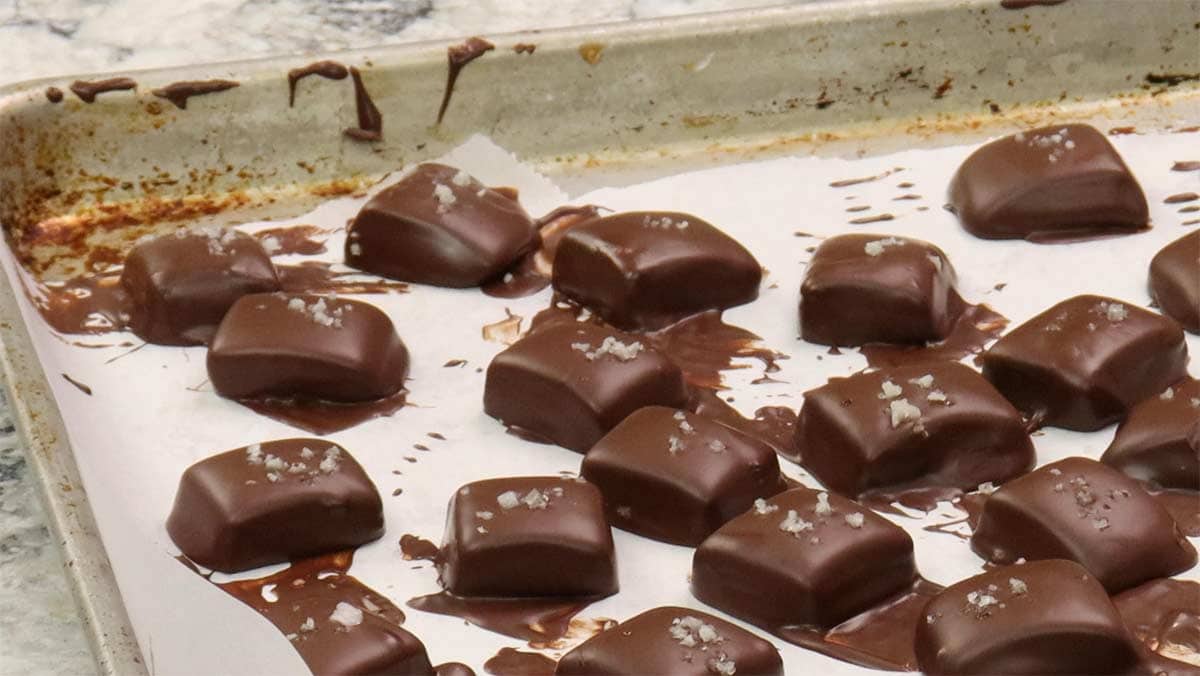 Tray of chocolate covered caramels.