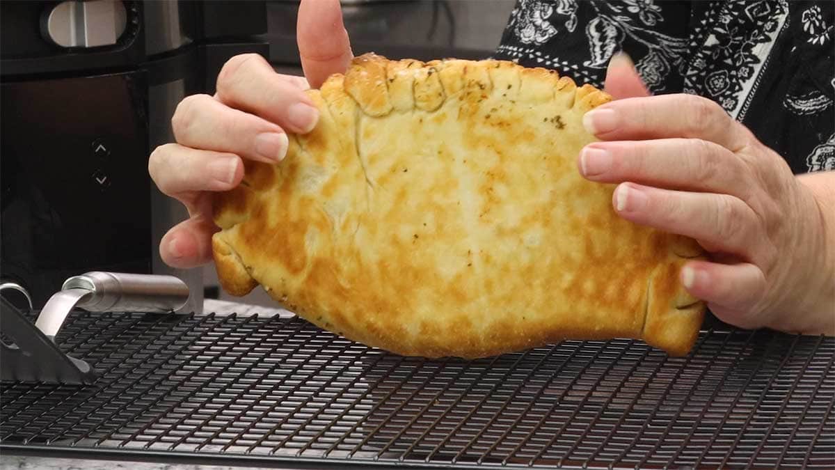showing the golden brown bottom of the calzone.