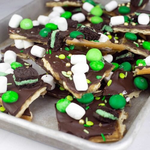 St. Patrick's Day Candy Toffee broken in pieces on a metal tray.
