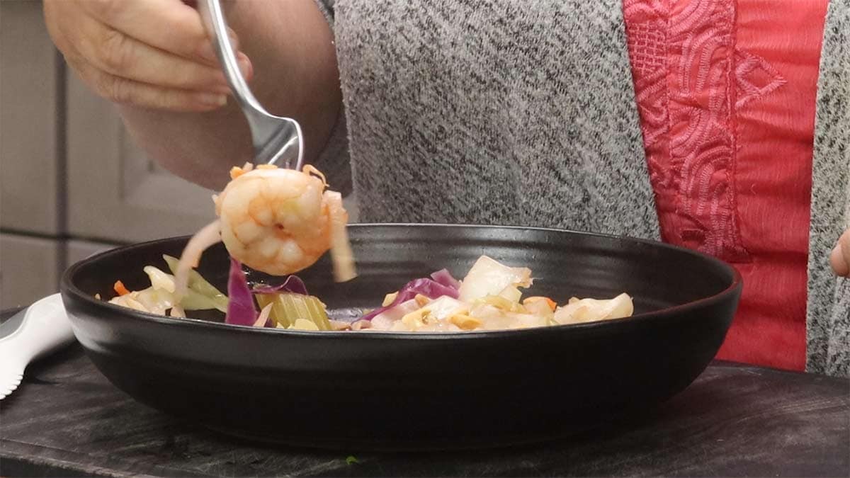 eating shrimp egg roll in a bowl. 