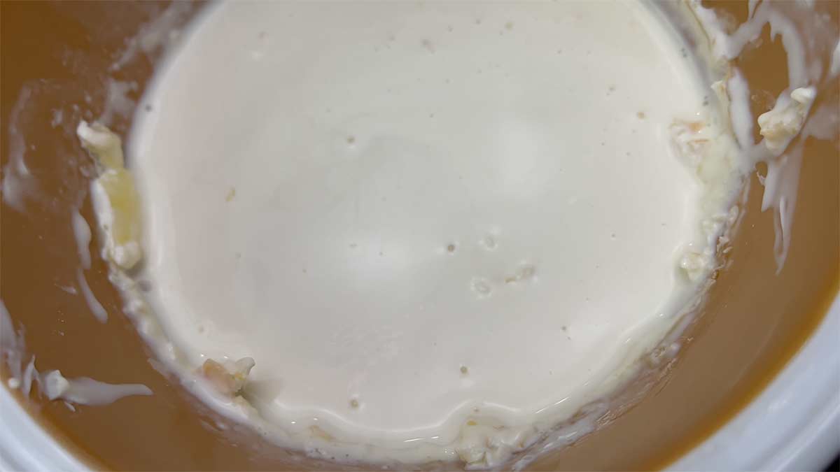 thin cream in bottom of bowl of clotted cream made using ultra pasteurized cream. 