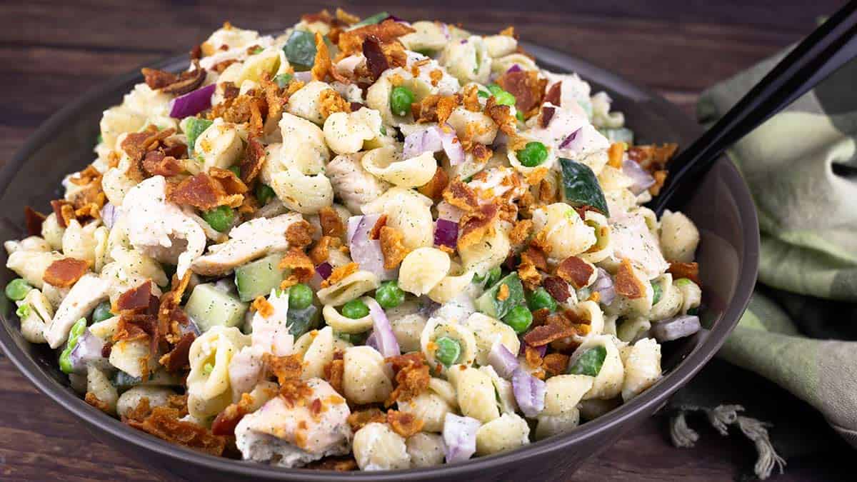 chicken bacon ranch pasta salad in a large brown bowl.