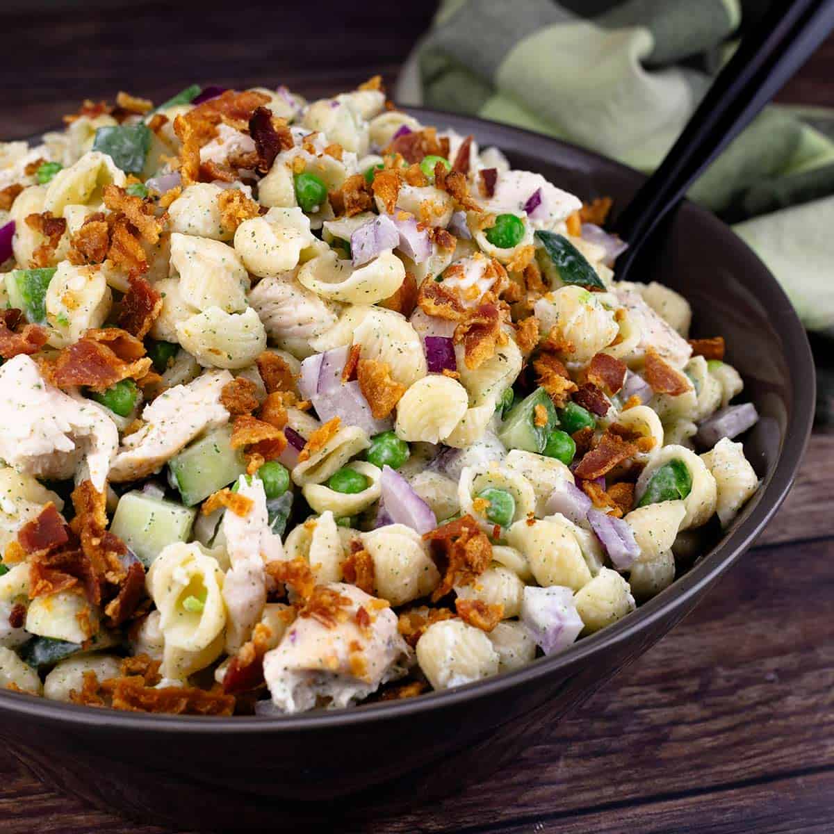 chicken bacon ranch pasta salad in a serving bowl.