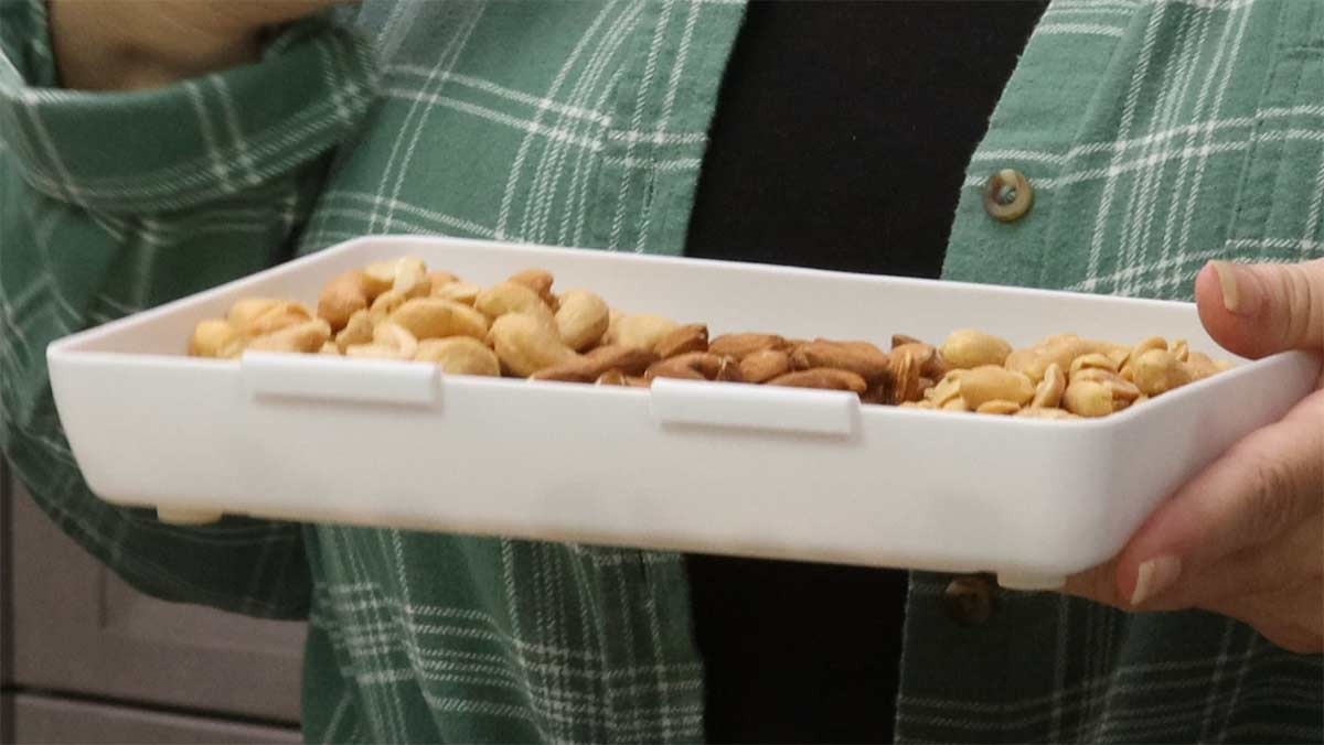 assorted nuts in a tray for Chex Mix.