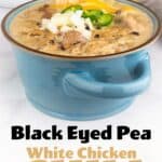 black eyed pea white chicken chili in a bowl with garnishes on top.