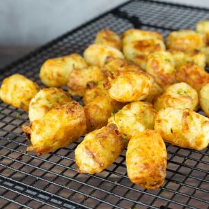 homemade tater tots air fried on cooling rack.