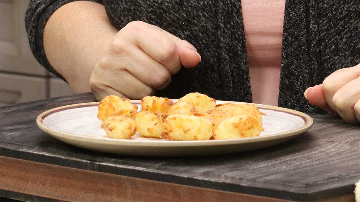 finished tater tots on a plate.