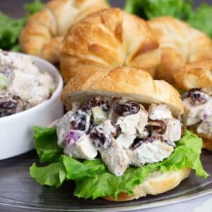 Cherry Chicken Salad on a croissant with lettuce.