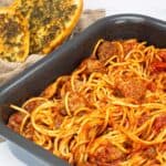 Ninja Combi Spaghetti and Meatballs with Garlic Bread on table ready to be served.