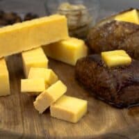 smoked butter beside a steak with smoked butter on top.