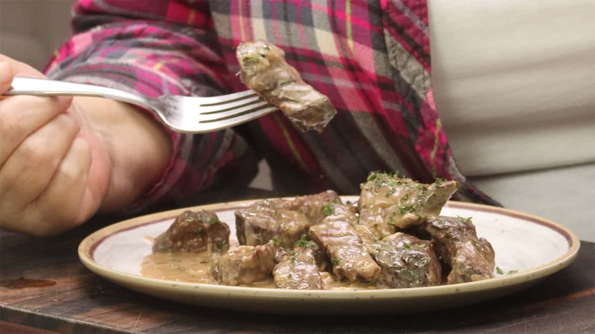 garlic parmesan steak bite on fork.