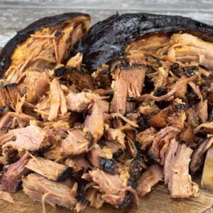 Pulled ham on a wood platter.