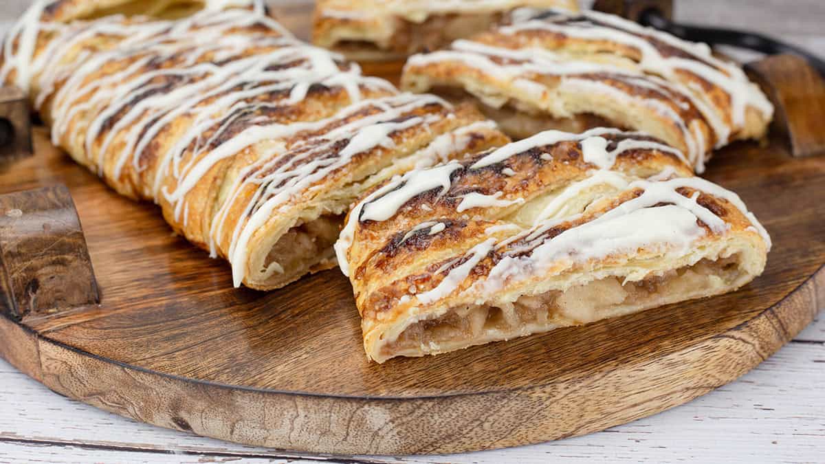 Apple Puff Pastry cut on a wooden board.