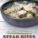 Garlic Steak Bites in dark bowl.
