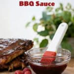 Raspberry BBQ sauce sitting next to ribs with text saying easy homemade raspberry bbq sauce.