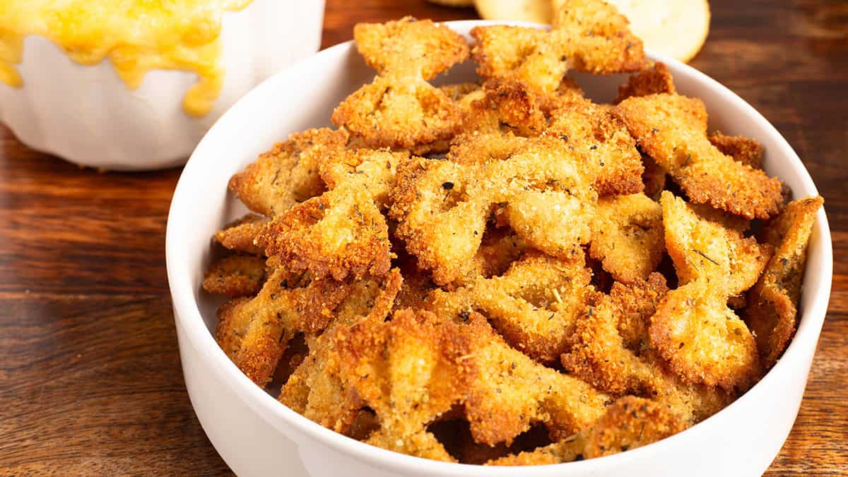 Air Fryer Pasta Chips in a white bowl next to dip