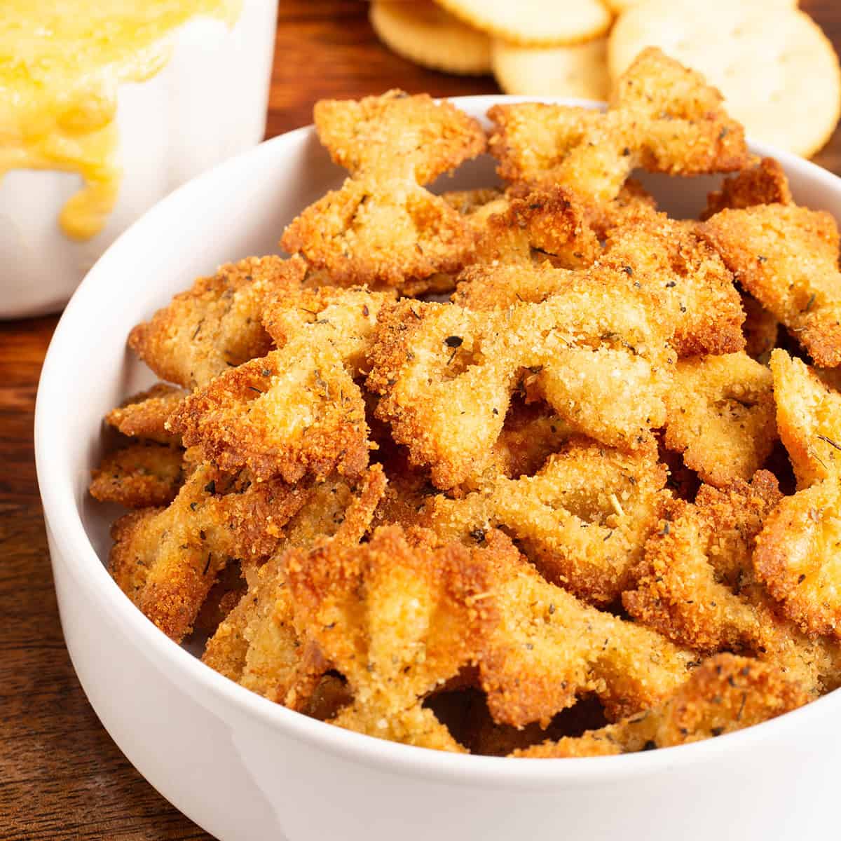 Air Fryer Pasta Chips in a white bowl next to dip