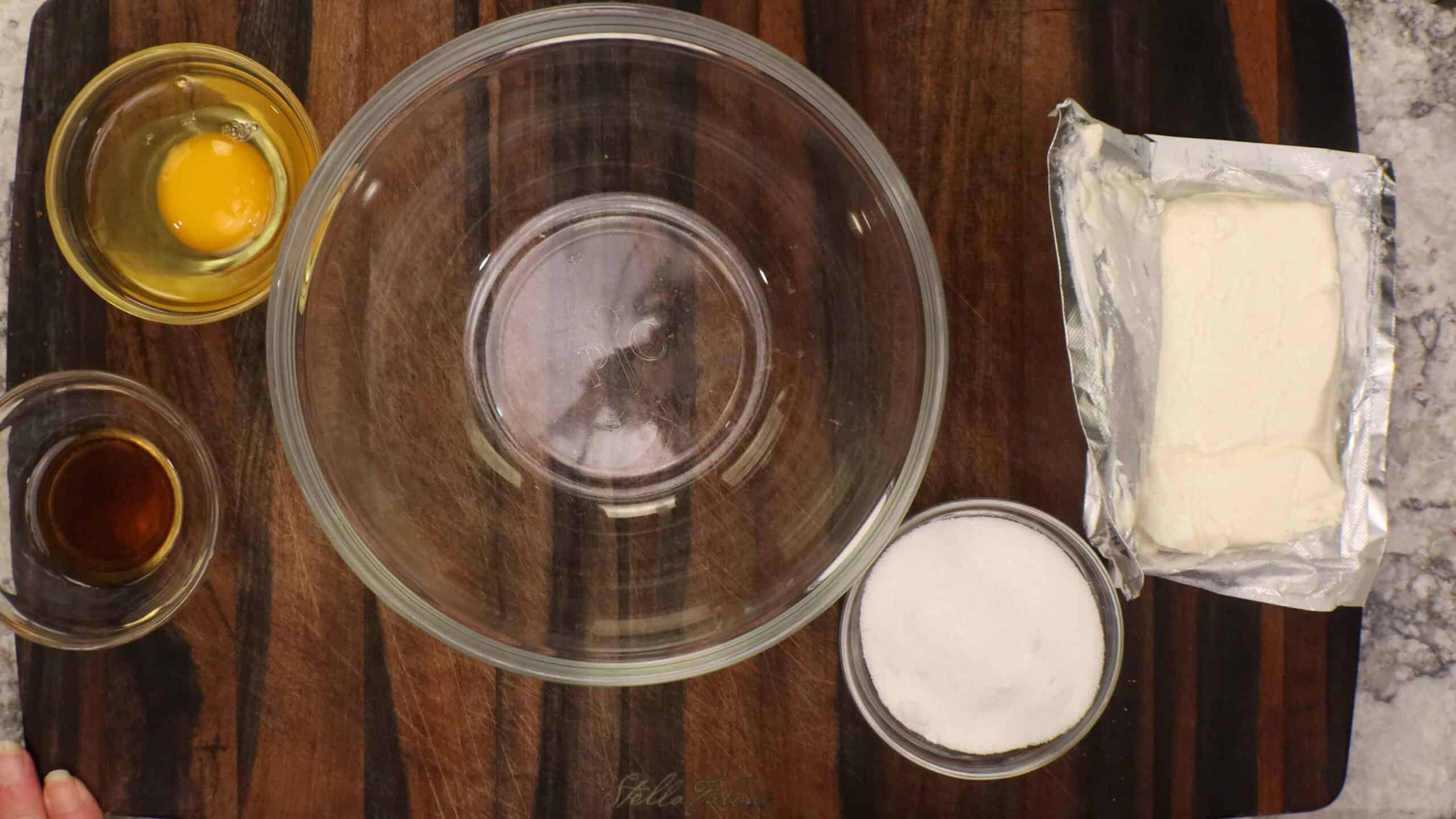 Ingredients laid out for making mini cherry cheesecakes