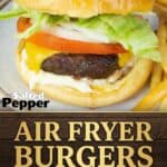 Air fryer burger on a sesame seed bun with lettuce, tomato, onion, and melted cheese. Text overlay reads Air Fryer Burgers - The Juiciest and Easiest Way to Cook a Burger.